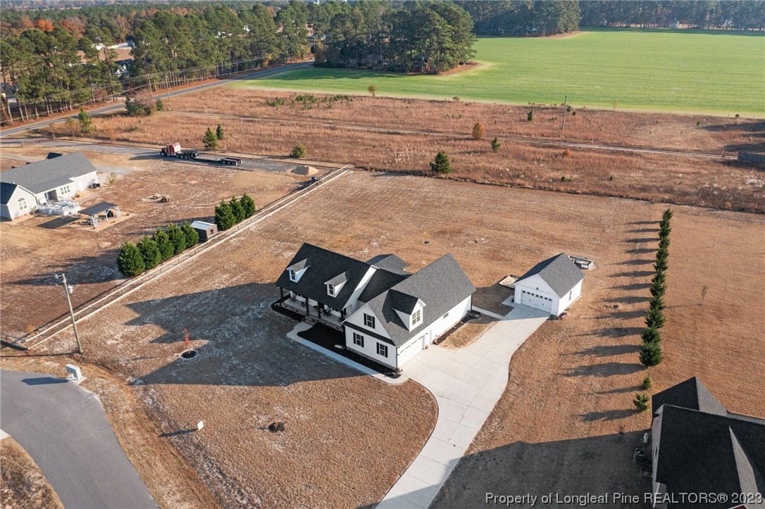 5654 Toby Pl Road Stedman, NC 28391 - Photo 40 of 42 an aerial view of a house with a yard basket ball court and outdoor seating
