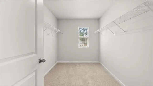 a view of room with window and closet