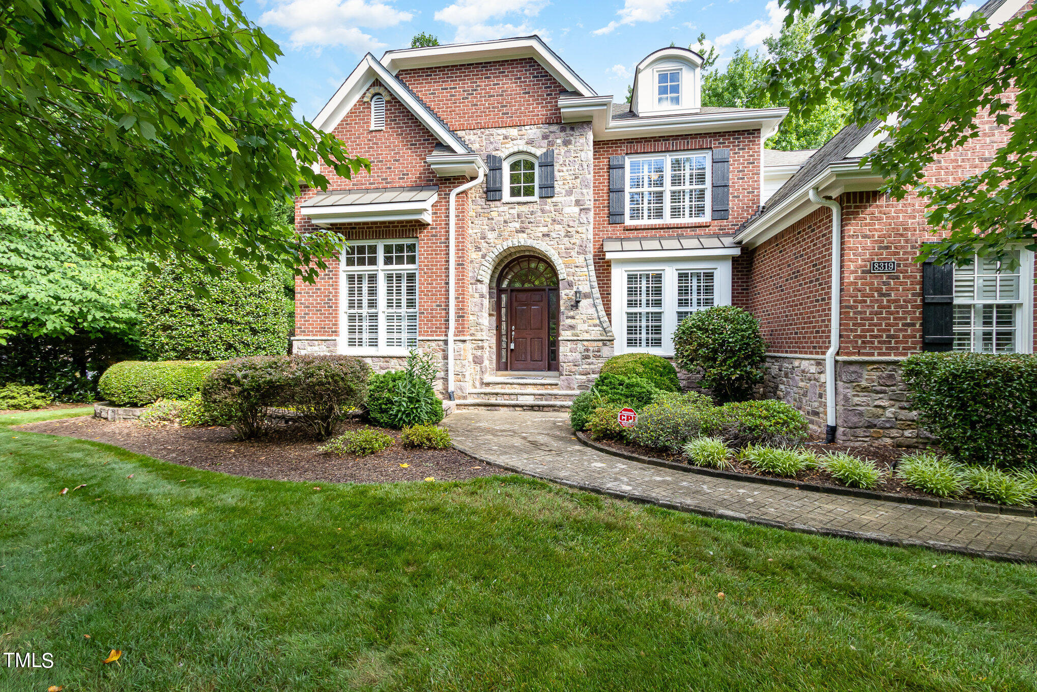 8319 La Matisse Road Raleigh, NC 27615 - Photo 1 of 46 a front view of a house with a garden and plants