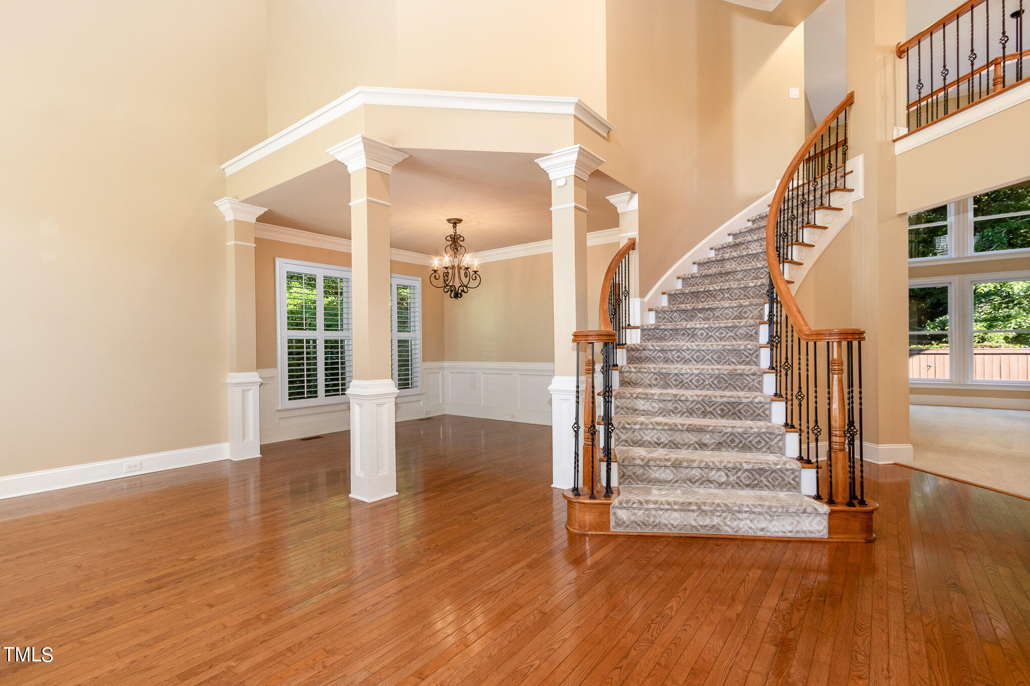 8319 La Matisse Road Raleigh, NC 27615 - Photo 5 of 46 a view of entryway and hall with wooden floor