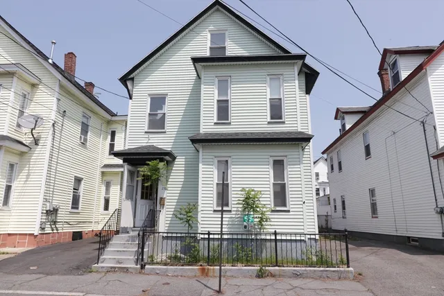 a front view of a house with garage