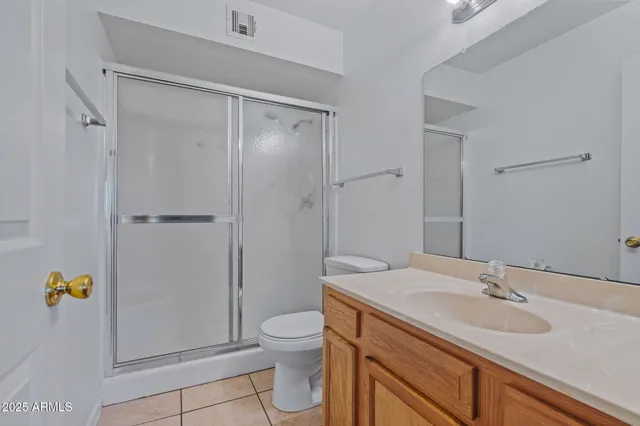 a bathroom with a glass door