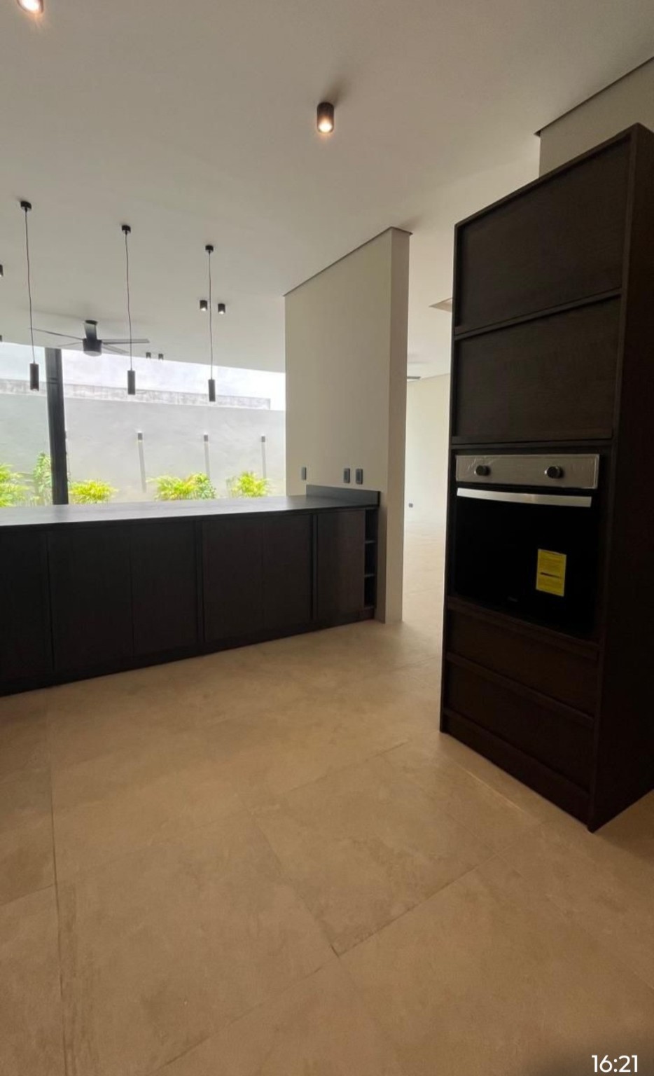 10 Río Residencial Street, Unit 17 Hankamer, TX 77560 - Photo 4 of 12 a room with kitchen island and stainless steel appliances