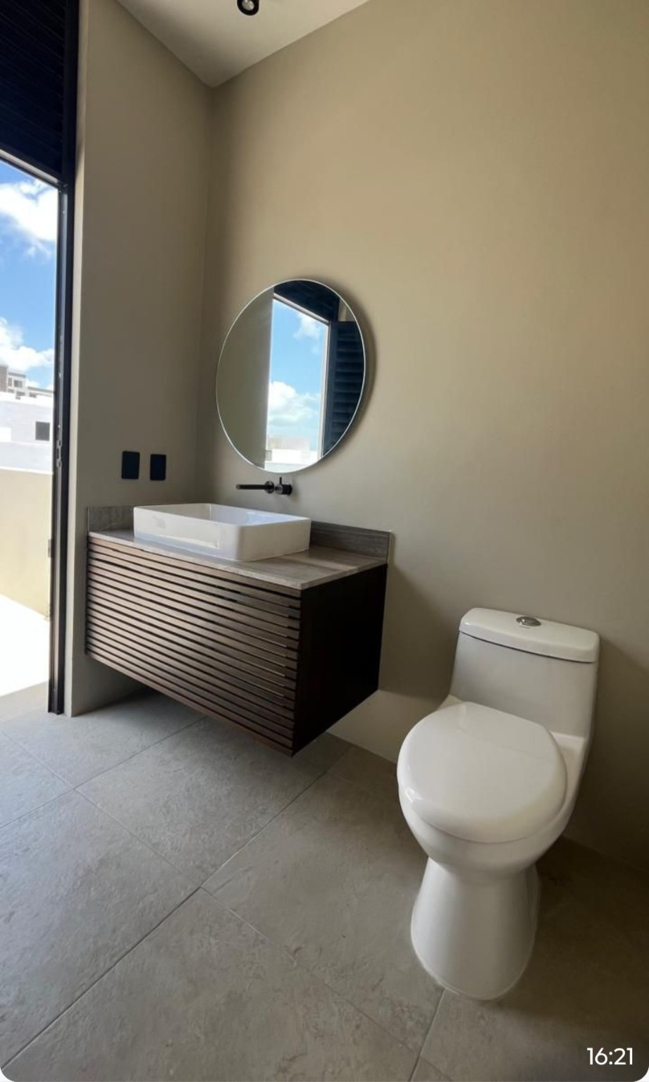 10 Río Residencial Street, Unit 17 Hankamer, TX 77560 - Photo 9 of 12 a bathroom with a toilet sink and mirror