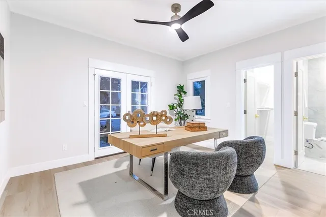 a living room with dining table and chairs