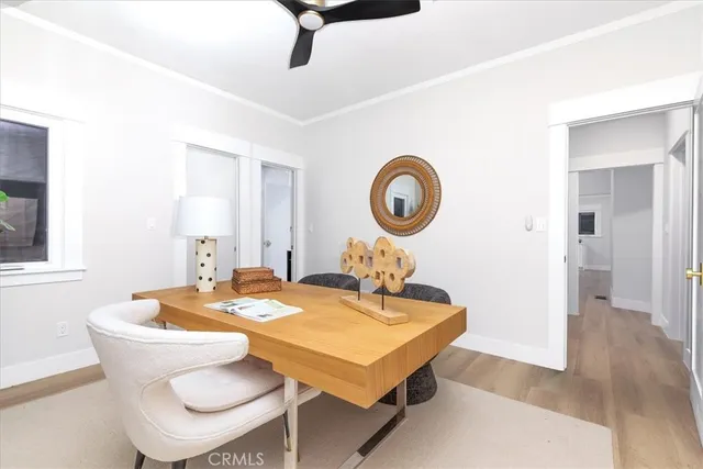 a bedroom with two beds and a window