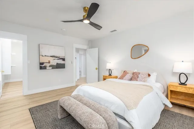 a living room with furniture and floor to ceiling windows