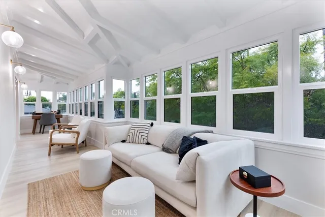 a view of a chair and tables in the balcony