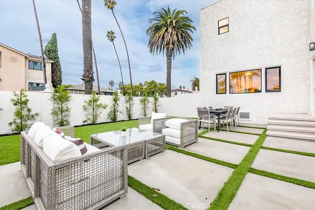 an aerial view of a house with swimming pool garden and patio