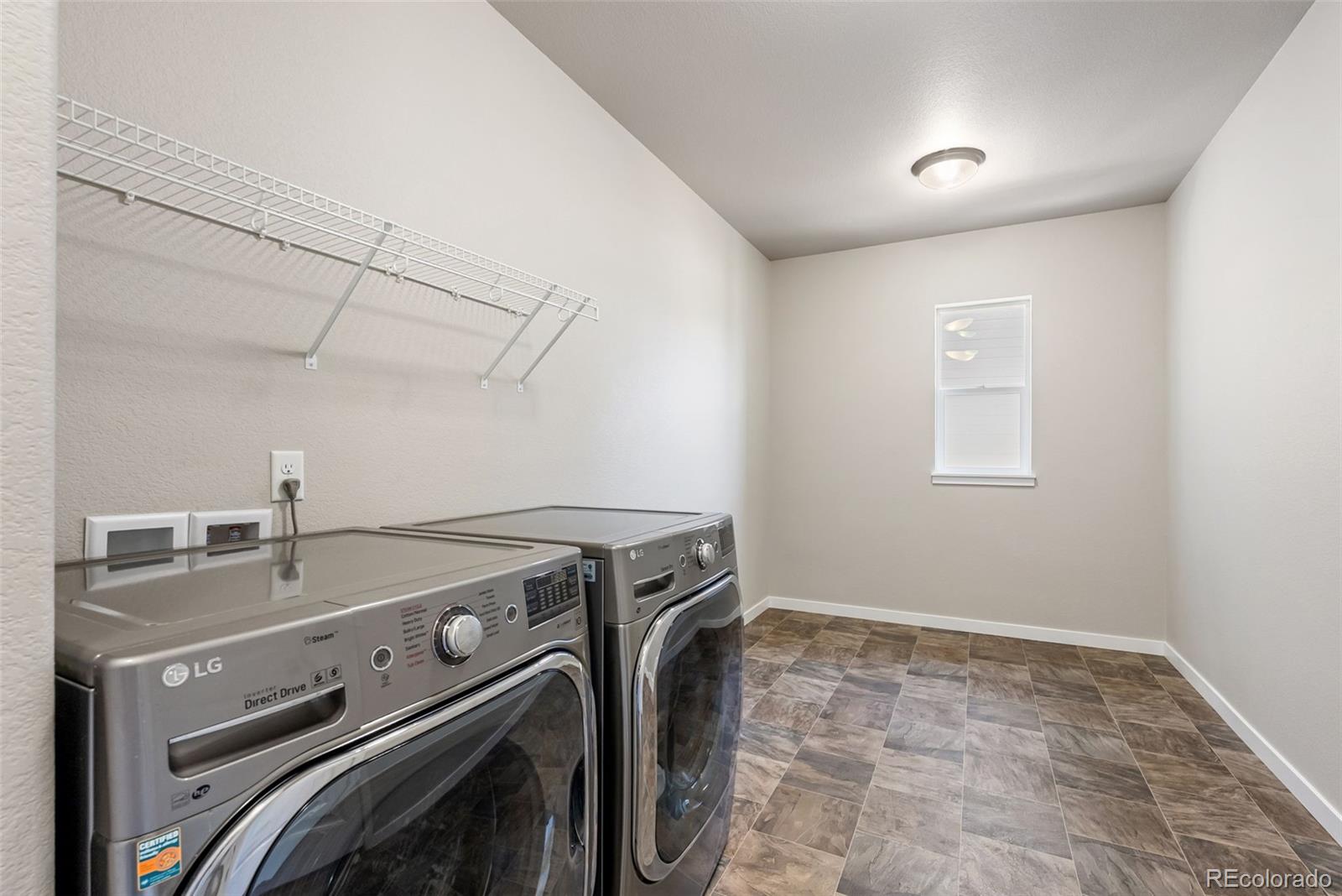 4508 Captain Jack Lane Colorado Springs, CO 80924 - Photo 11 of 50 a utility room with dryer and washer