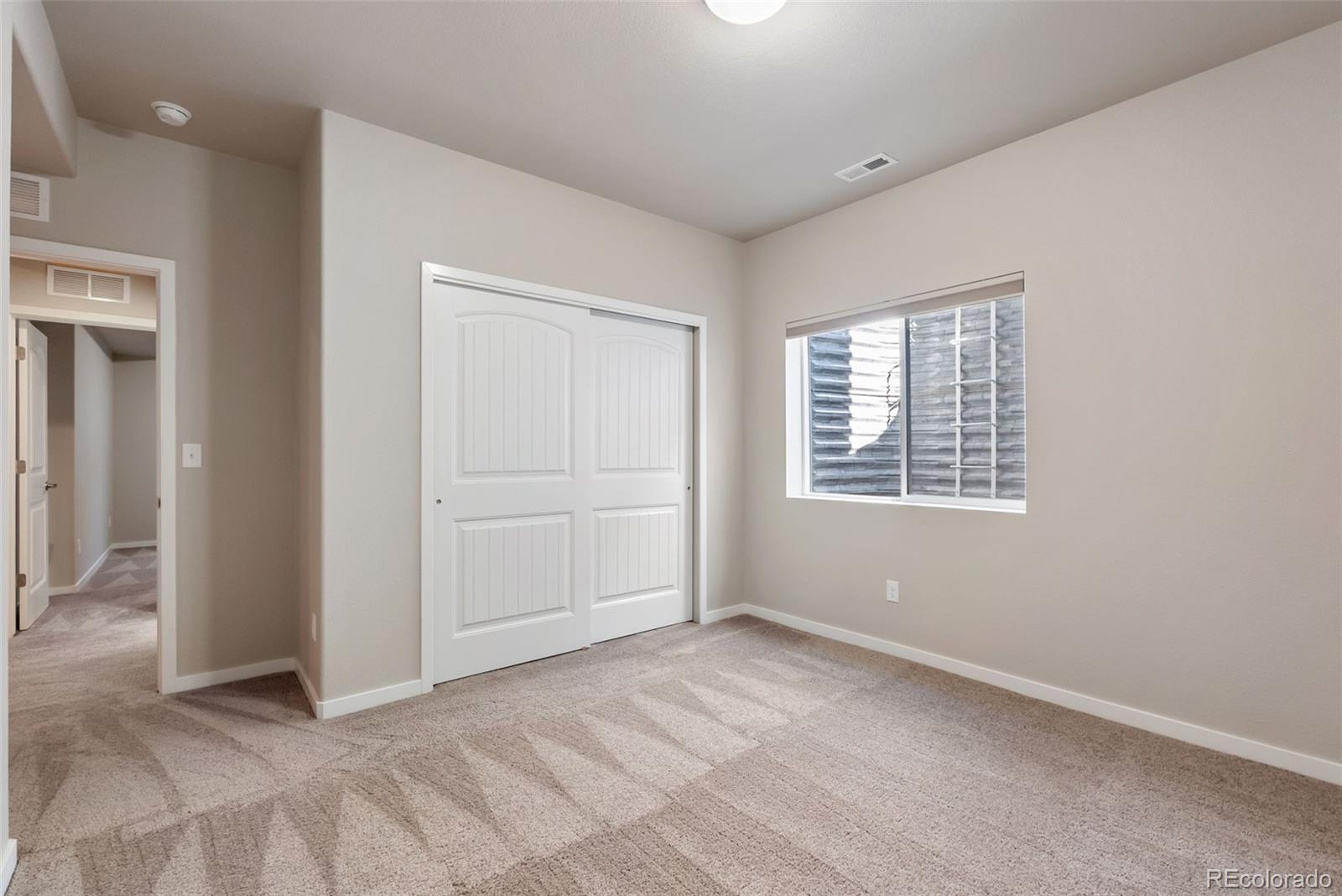 4508 Captain Jack Lane Colorado Springs, CO 80924 - Photo 27 of 50 an empty room with windows