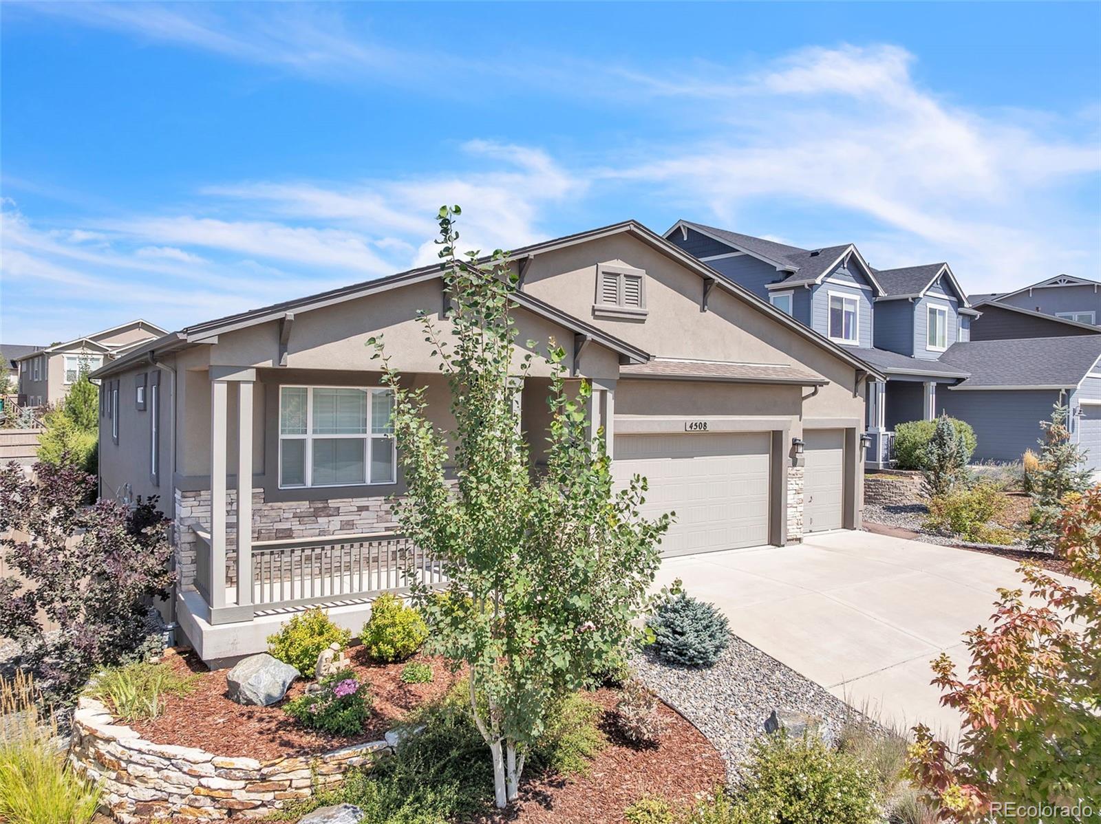 4508 Captain Jack Lane Colorado Springs, CO 80924 - Photo 40 of 50 a front view of a house with a yard