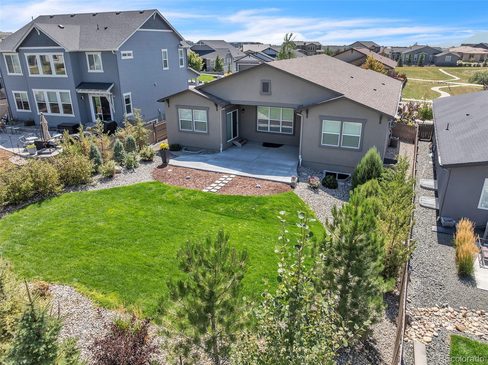 4508 Captain Jack Lane Colorado Springs, CO 80924 - Photo 42 of 50 a front view of a house with a yard