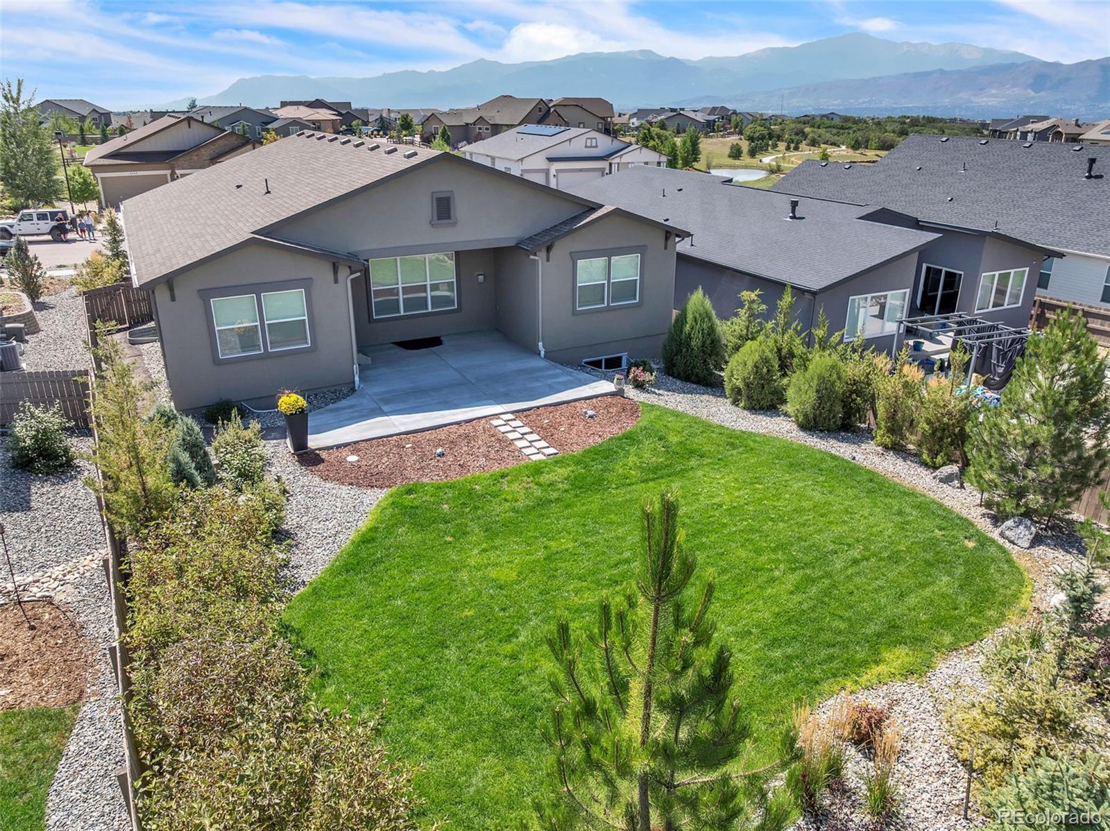 4508 Captain Jack Lane Colorado Springs, CO 80924 - Photo 43 of 50 an aerial view of a house with a garden