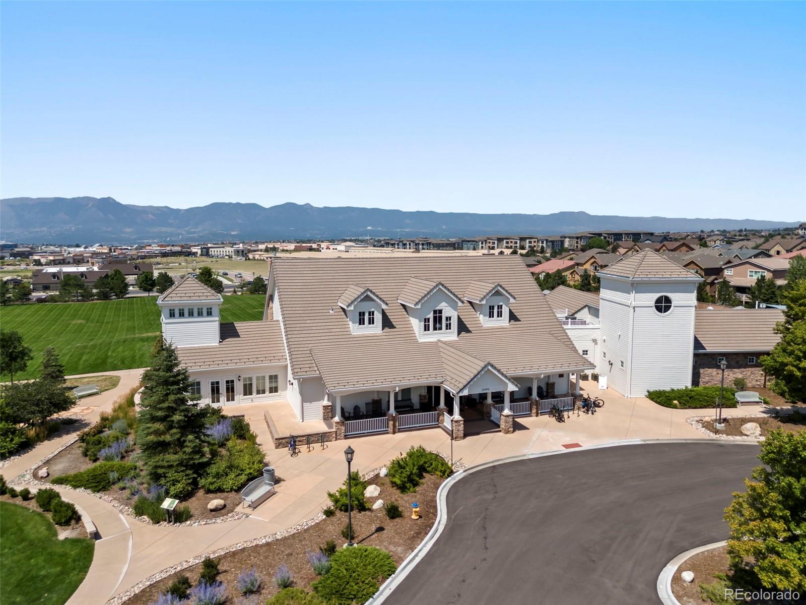 4508 Captain Jack Lane Colorado Springs, CO 80924 - Photo 47 of 50 a view of a house with outdoor space and a car park in the back
