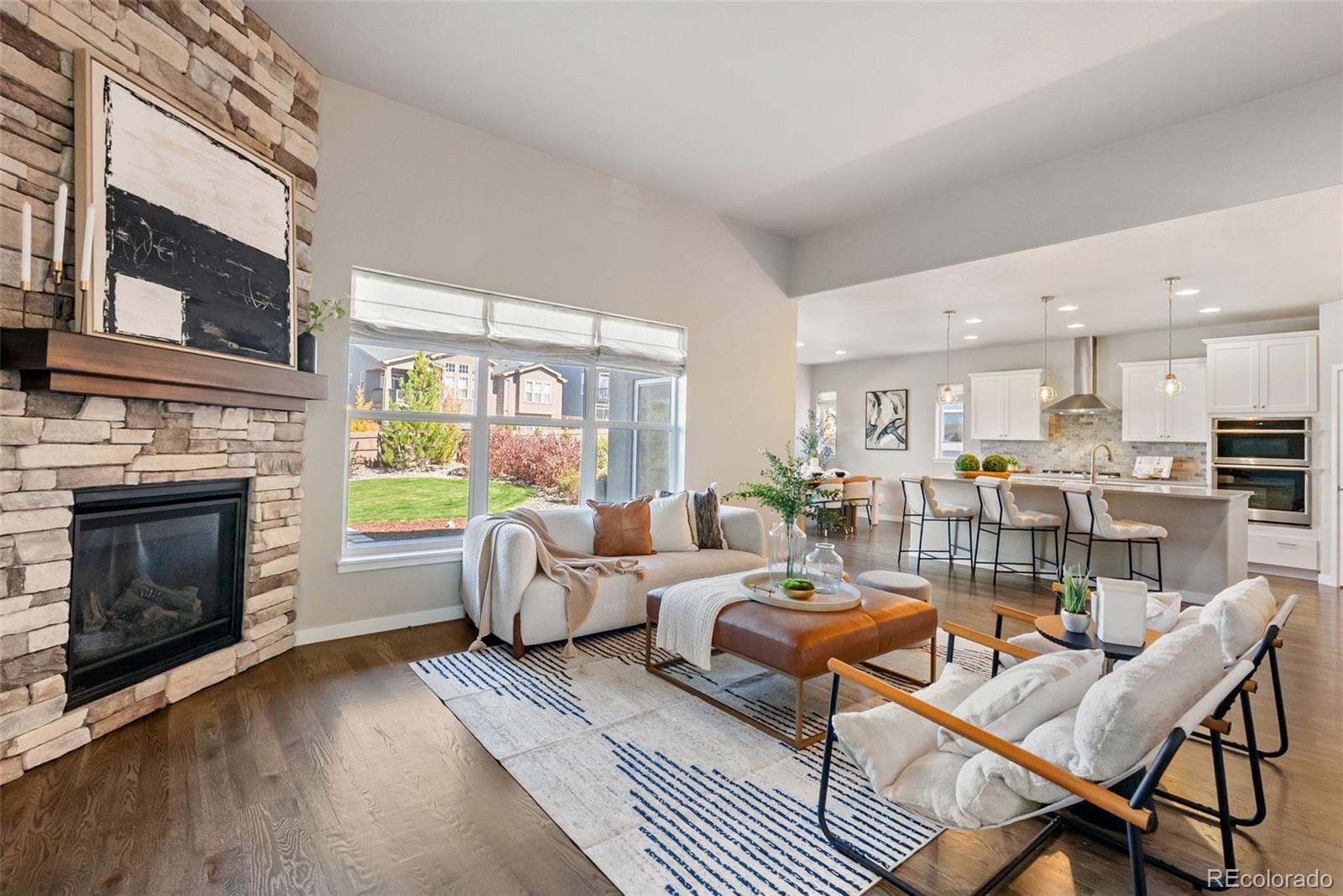 4508 Captain Jack Lane Colorado Springs, CO 80924 - Photo 8 of 50 a living room with fireplace furniture and a fireplace