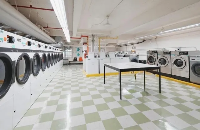 a utility room with lots of appliances and cabinets