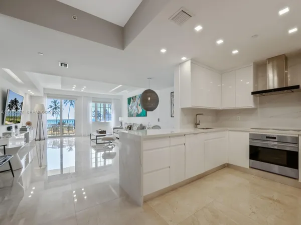 a kitchen with counter top space cabinets and stainless steel appliances