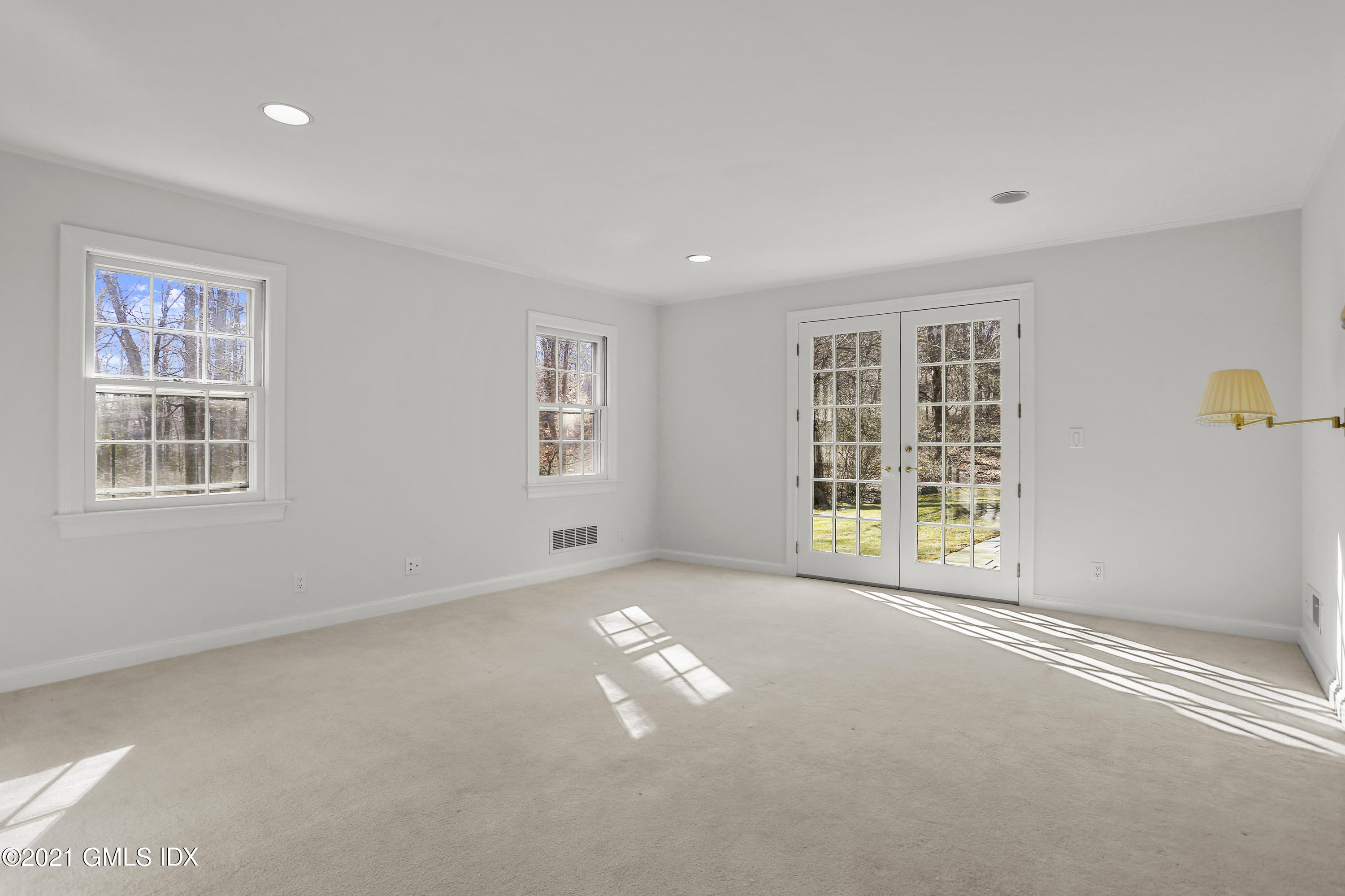 99 Hunting Ridge Road Greenwich, CT 06831 - Photo 16 of 23 a view of an empty room with a window