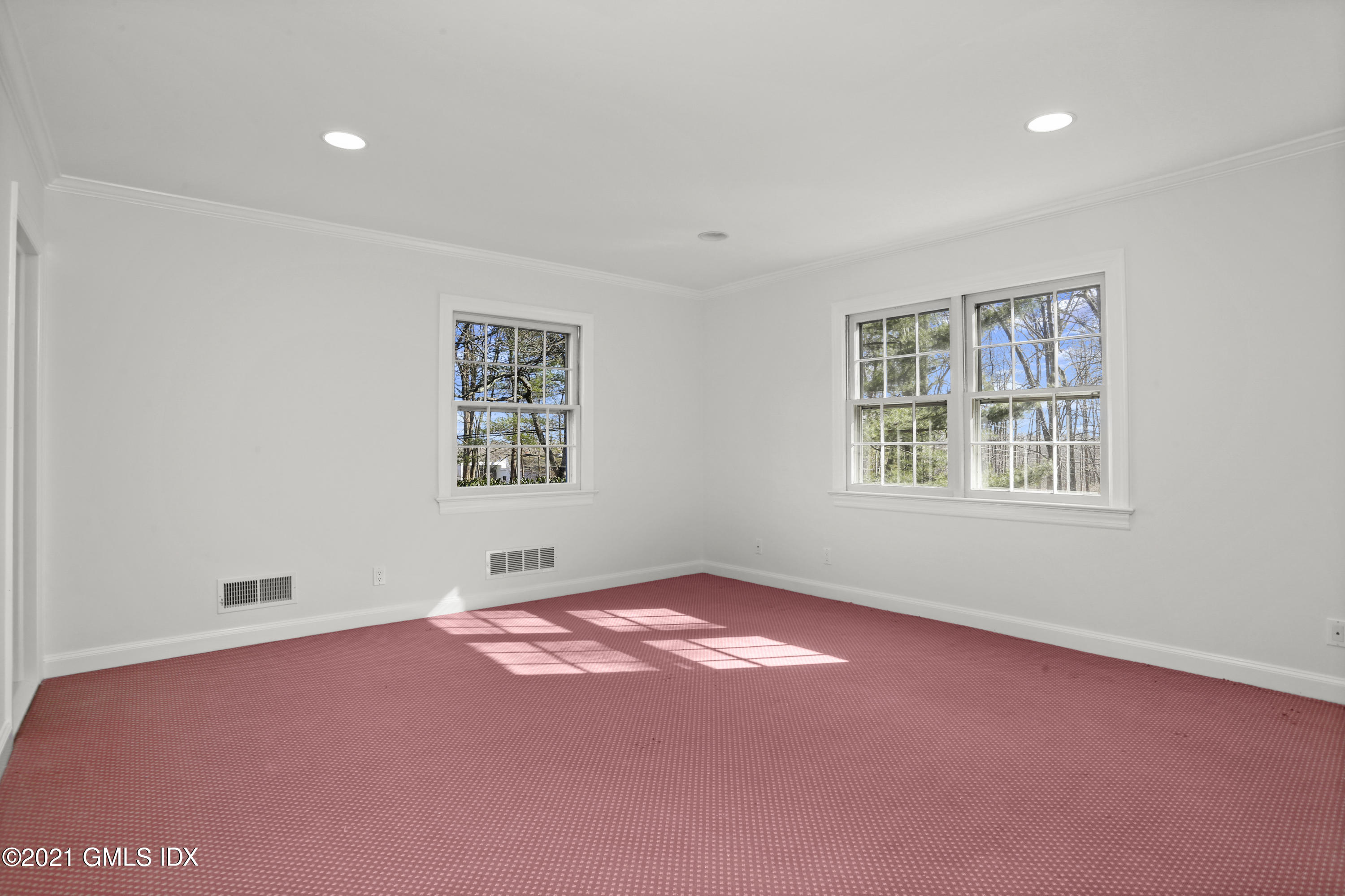 99 Hunting Ridge Road Greenwich, CT 06831 - Photo 18 of 23 an empty room with windows