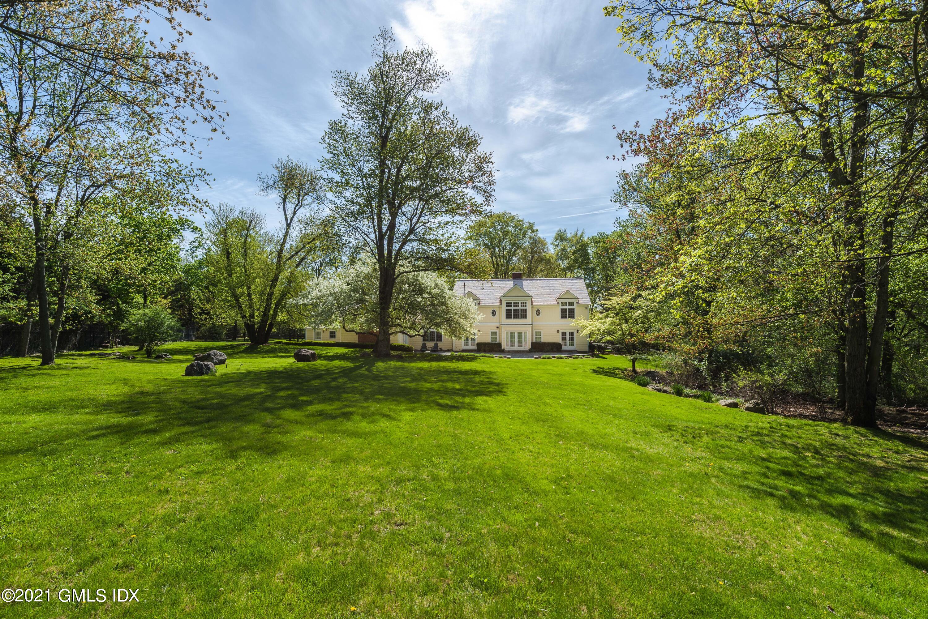 99 Hunting Ridge Road Greenwich, CT 06831 - Photo 2 of 23 a view of a park with large trees
