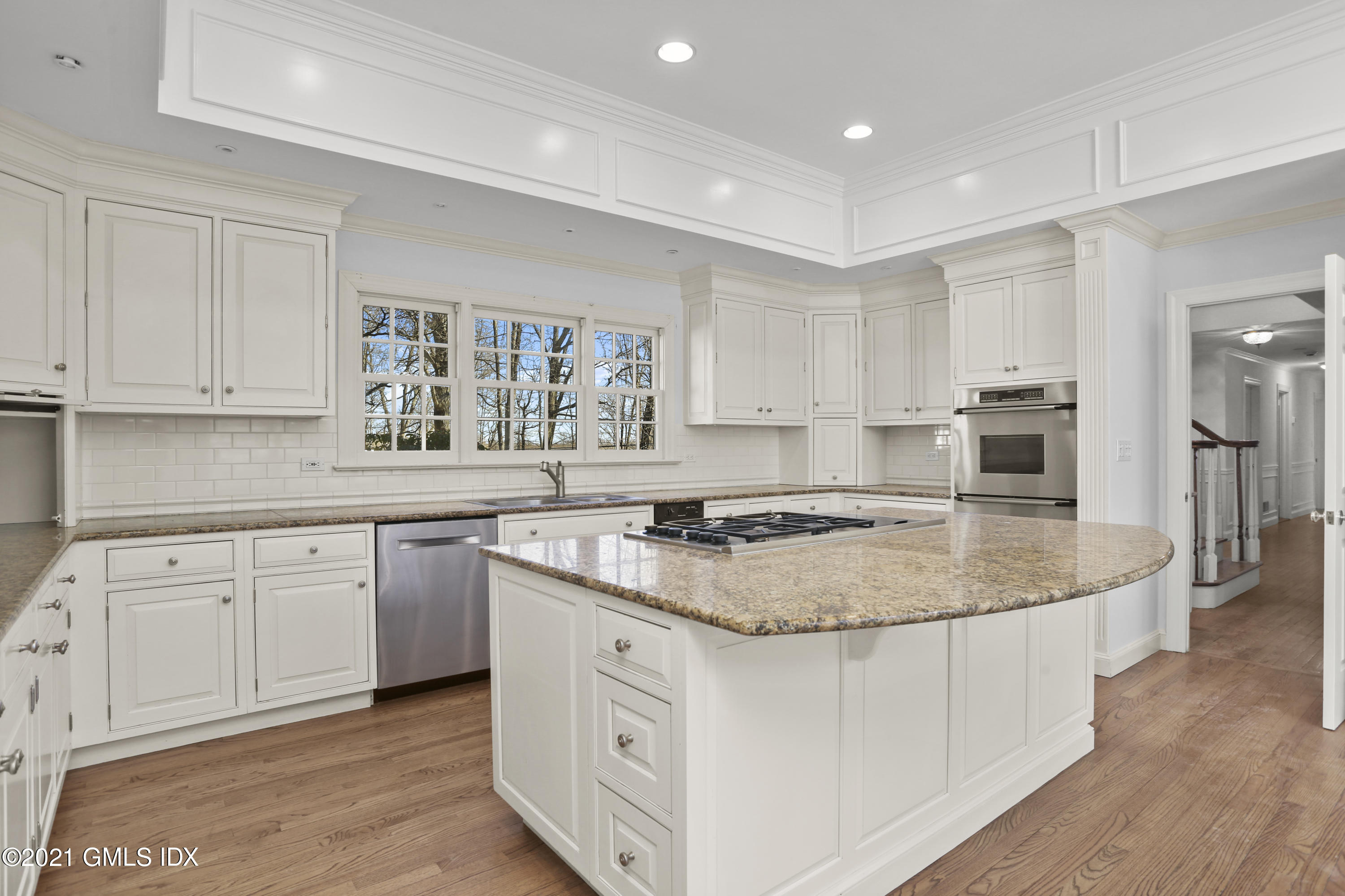 99 Hunting Ridge Road Greenwich, CT 06831 - Photo 5 of 23 a kitchen with stainless steel appliances granite countertop a stove a sink and a microwave