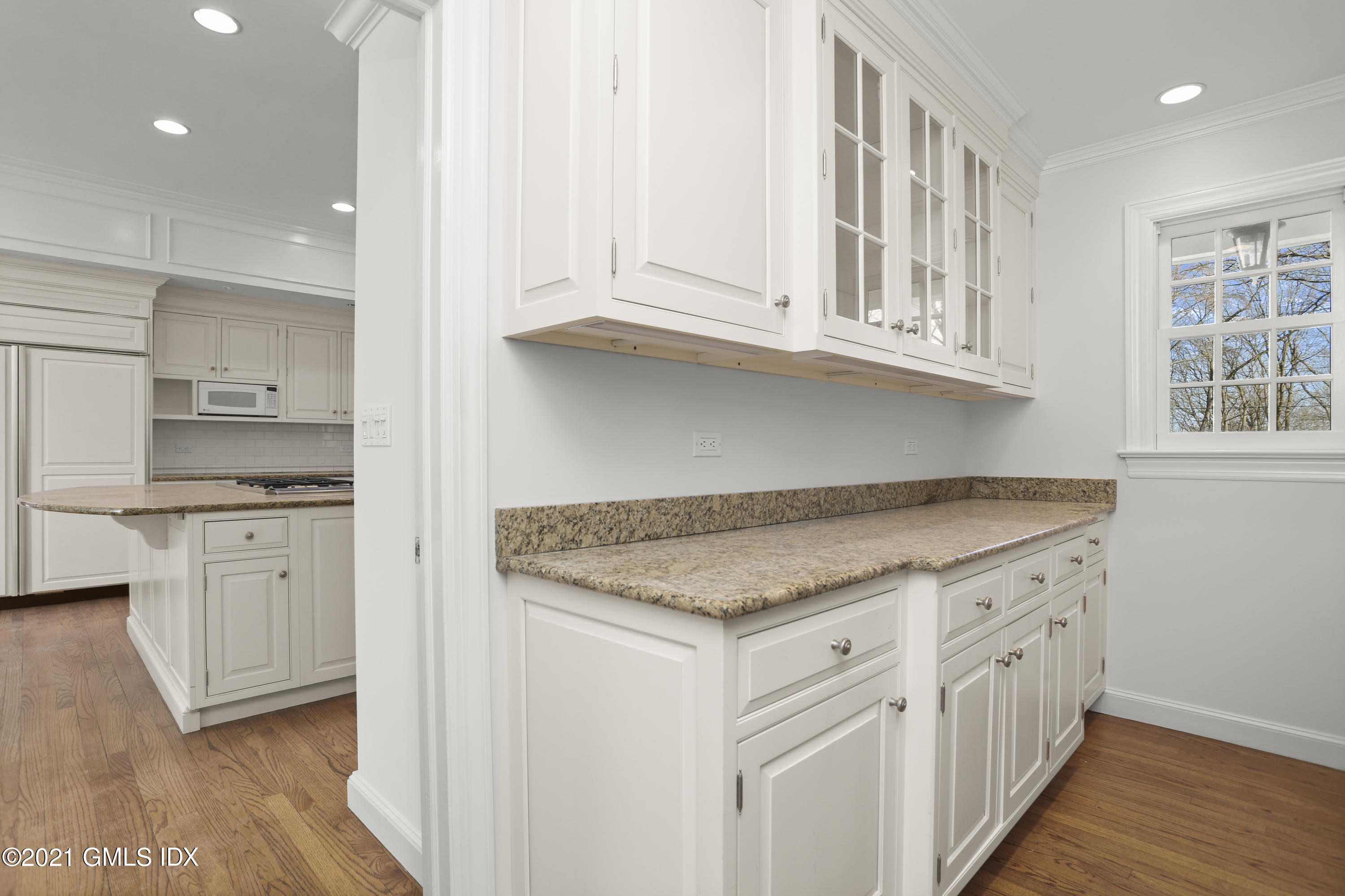 99 Hunting Ridge Road Greenwich, CT 06831 - Photo 9 of 23 a kitchen with granite countertop white cabinets and a sink