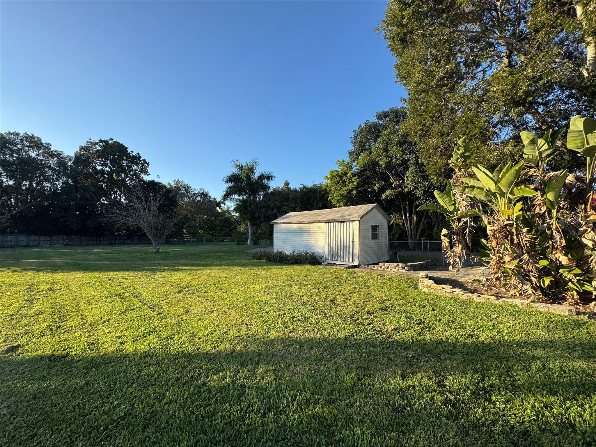 5221 Southwest 201st Terrace Southwest Ranches, FL 33332 - Photo 13 of 15 a house with a field