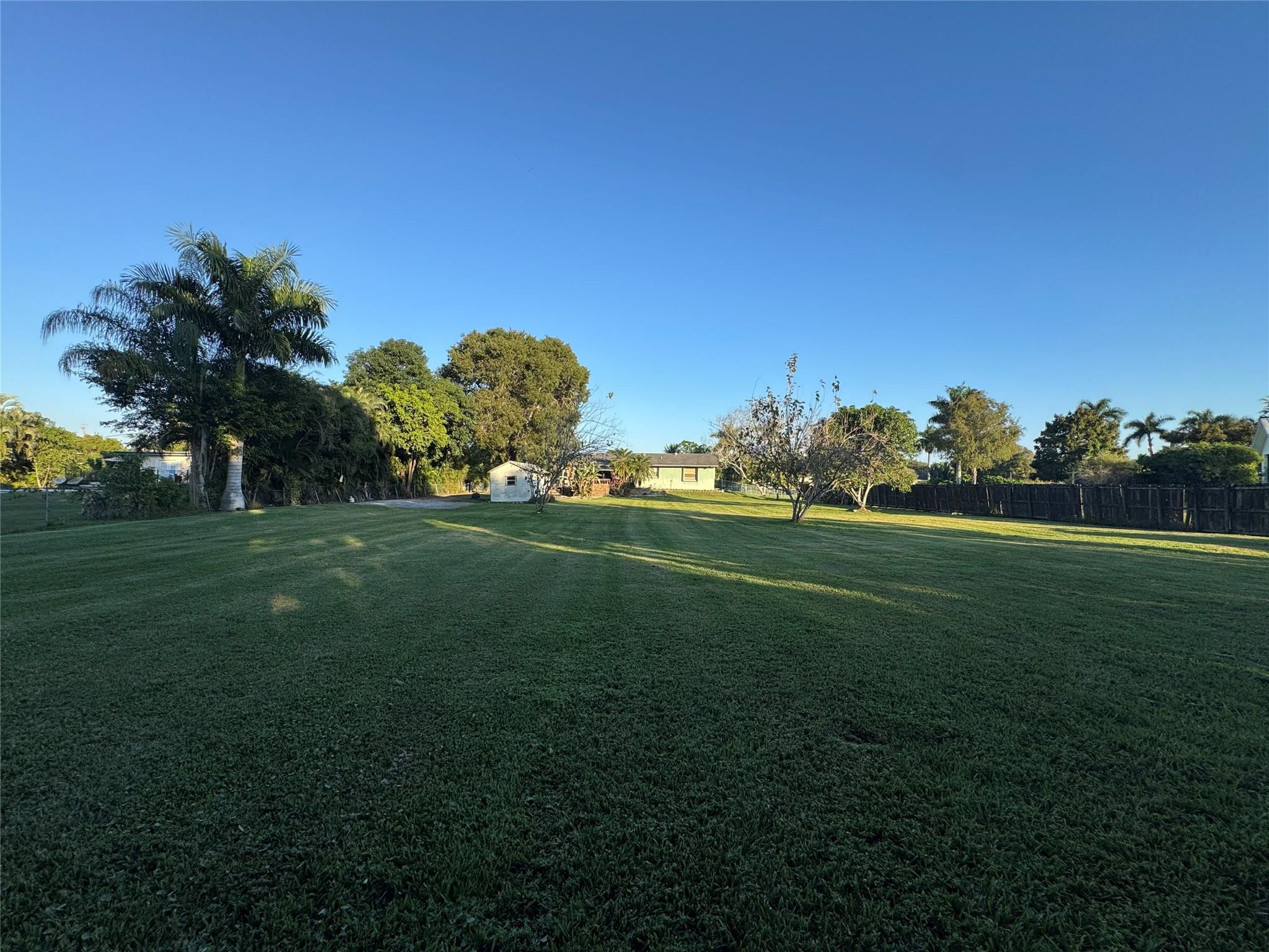 5221 Southwest 201st Terrace Southwest Ranches, FL 33332 - Photo 4 of 15 a garden with trees in the background