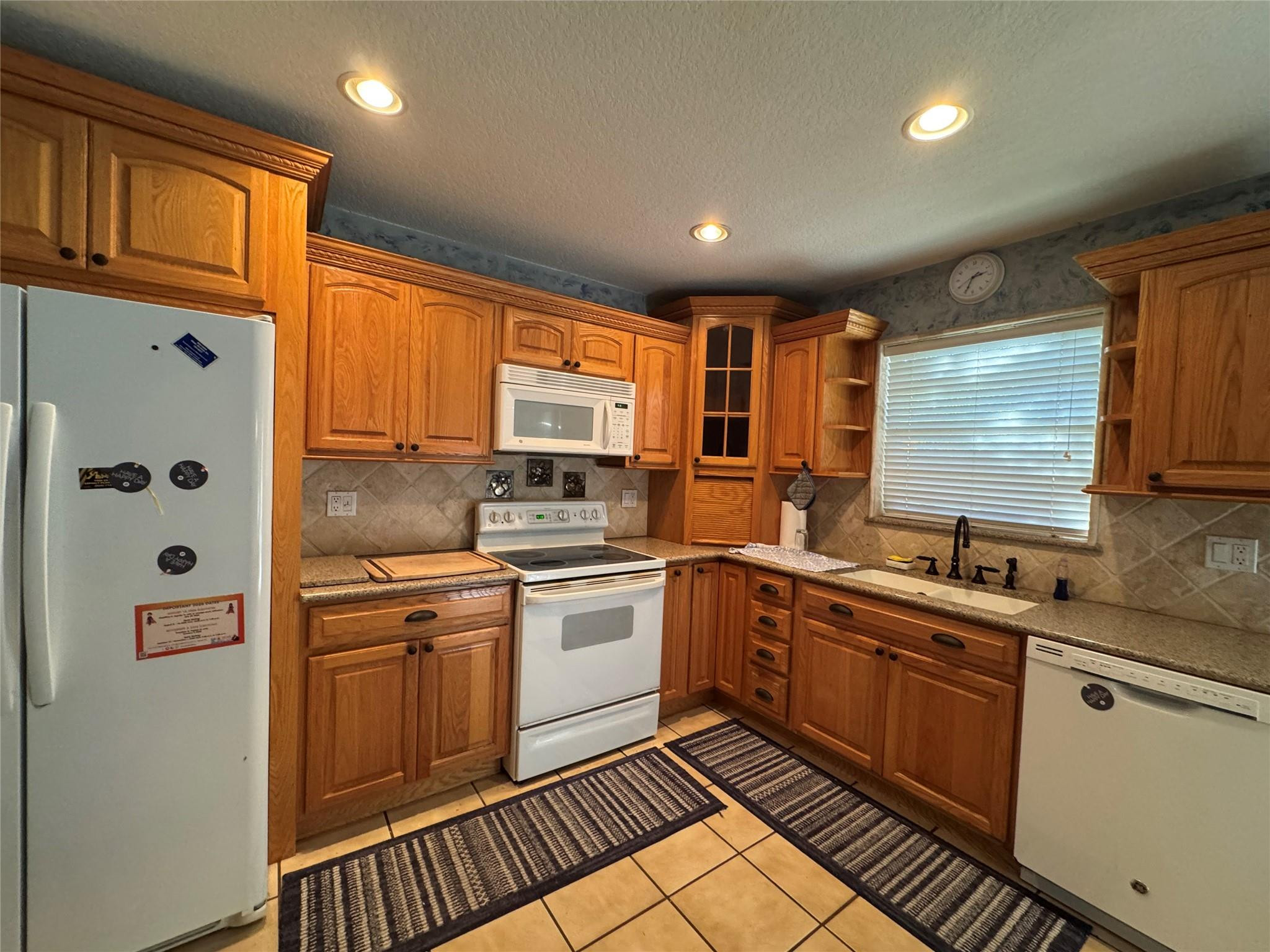 5221 Southwest 201st Terrace Southwest Ranches, FL 33332 - Photo 5 of 15 a kitchen with stainless steel appliances granite countertop a sink and cabinets