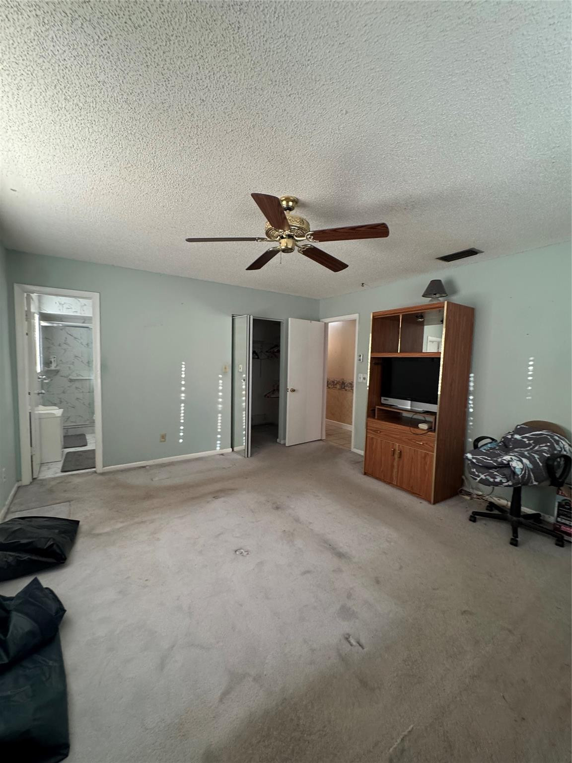 5221 Southwest 201st Terrace Southwest Ranches, FL 33332 - Photo 6 of 15 a view of a livingroom with furniture and a ceiling fan