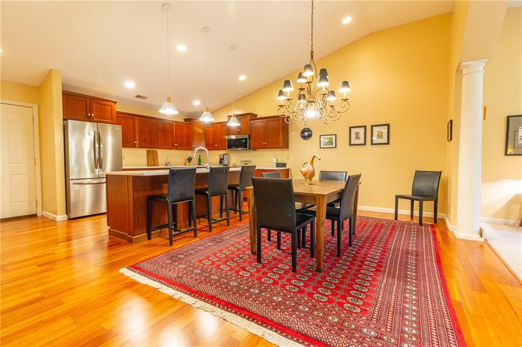 138 Abbey Road New Castle, PA 16105 - Photo 12 of 36 a living room with dining room and wooden floor