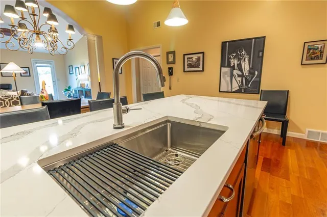 a kitchen with a sink and a refrigerator