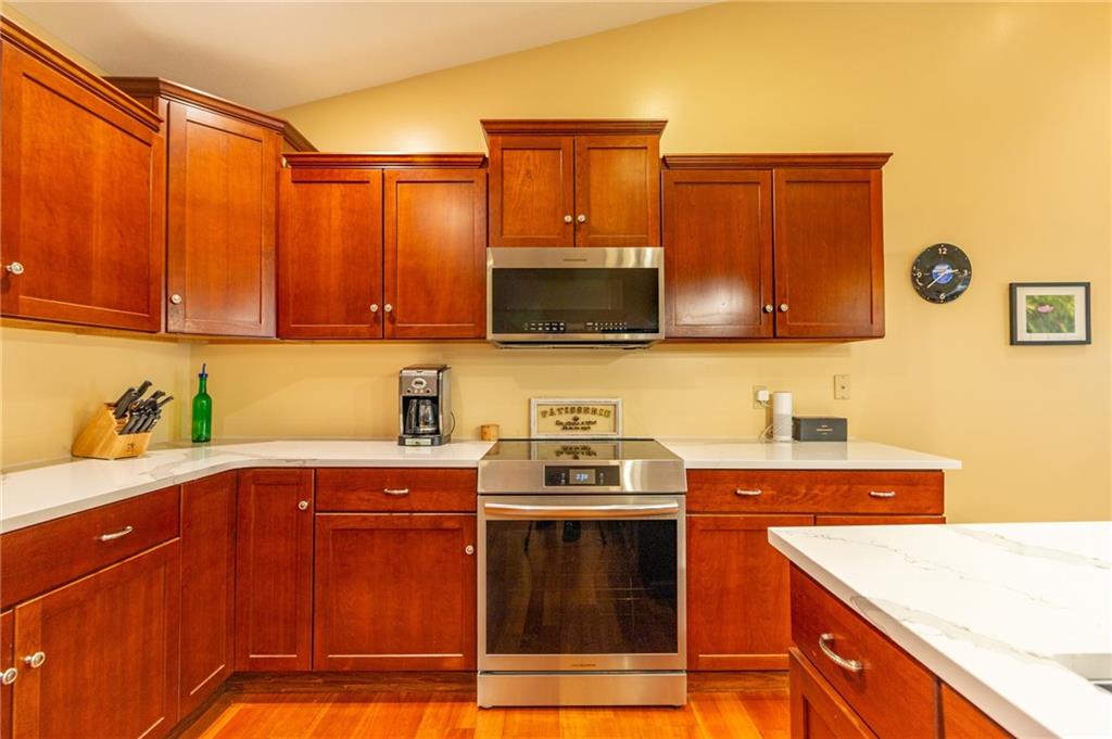 138 Abbey Road New Castle, PA 16105 - Photo 20 of 36 a kitchen with stainless steel appliances granite countertop a sink stove and microwave