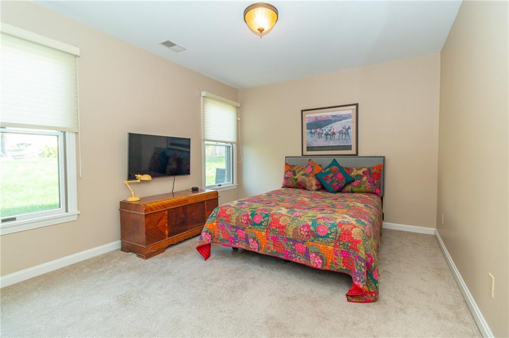 138 Abbey Road New Castle, PA 16105 - Photo 28 of 36 a bedroom with a bed and a flat screen tv