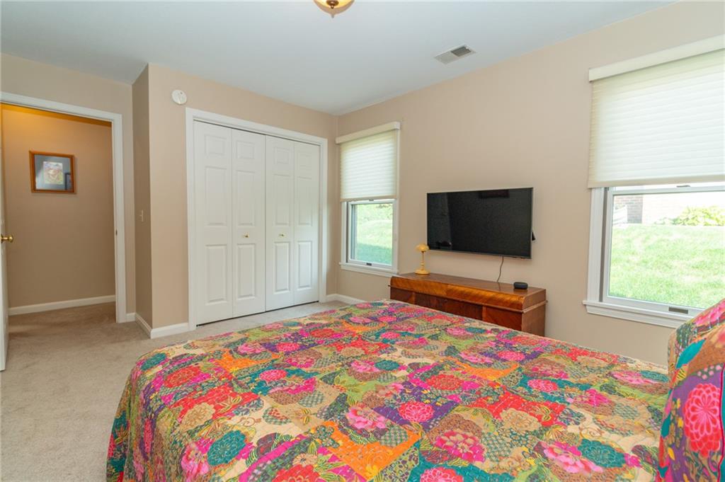 138 Abbey Road New Castle, PA 16105 - Photo 29 of 36 a bedroom with a bed and a flat screen tv