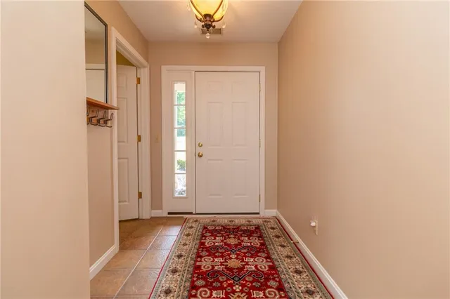 a view of hallway with wooden floor