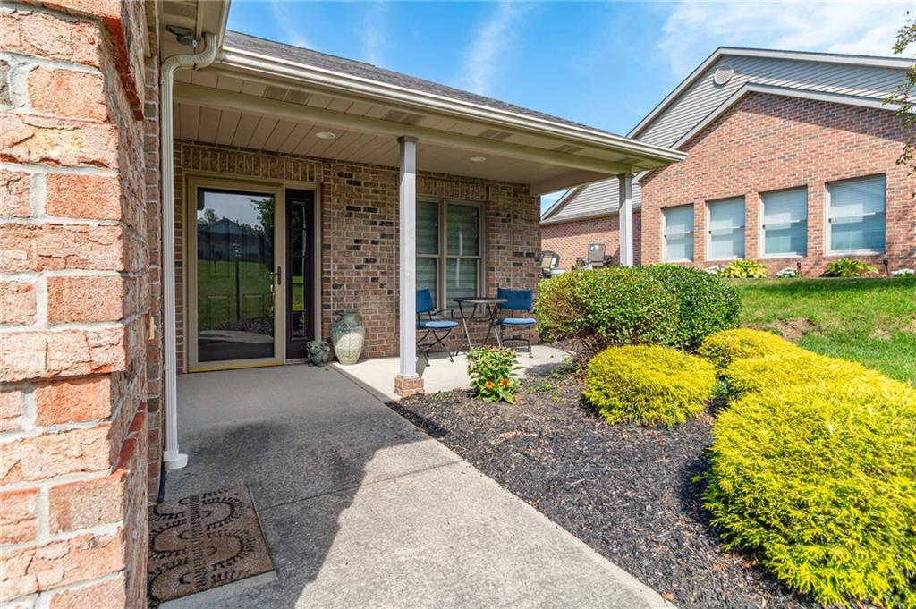 138 Abbey Road New Castle, PA 16105 - Photo 35 of 36 a front view of a house with garden and outdoor seating