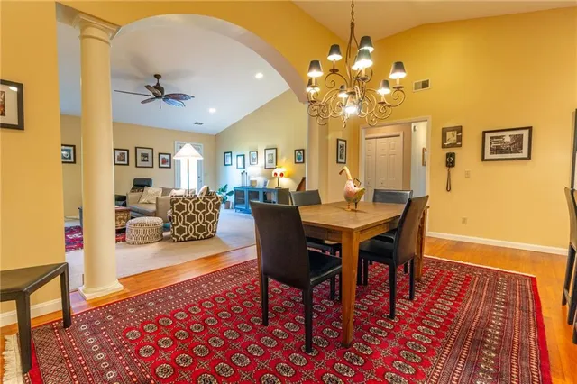 a view of a dining room with furniture and wooden floor