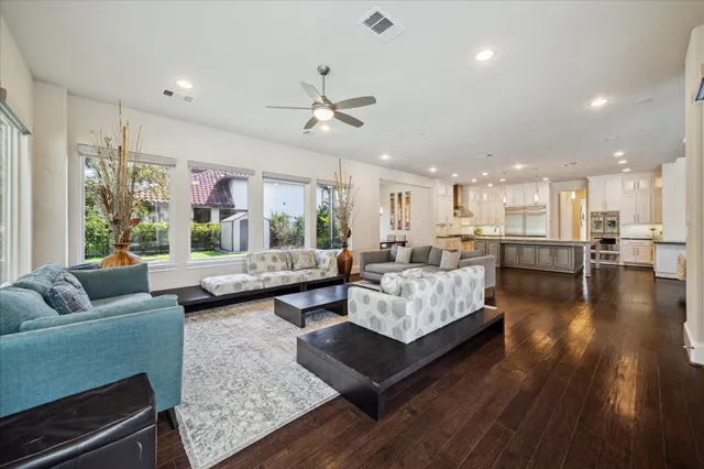 a bathroom with a double vanity sink a mirror a bathtub and shower