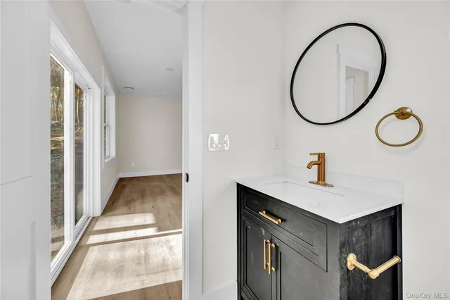 a bathroom with a sink and a mirror