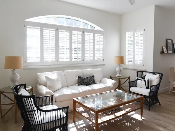 a living room with furniture and a window