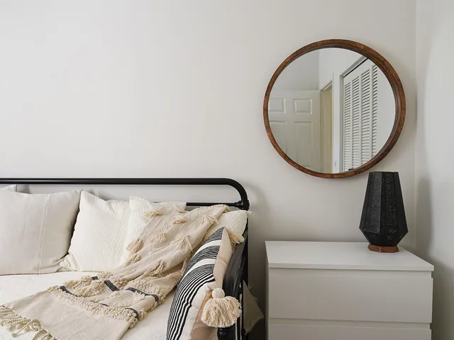 a kitchen with a dining table chairs sink and cabinets