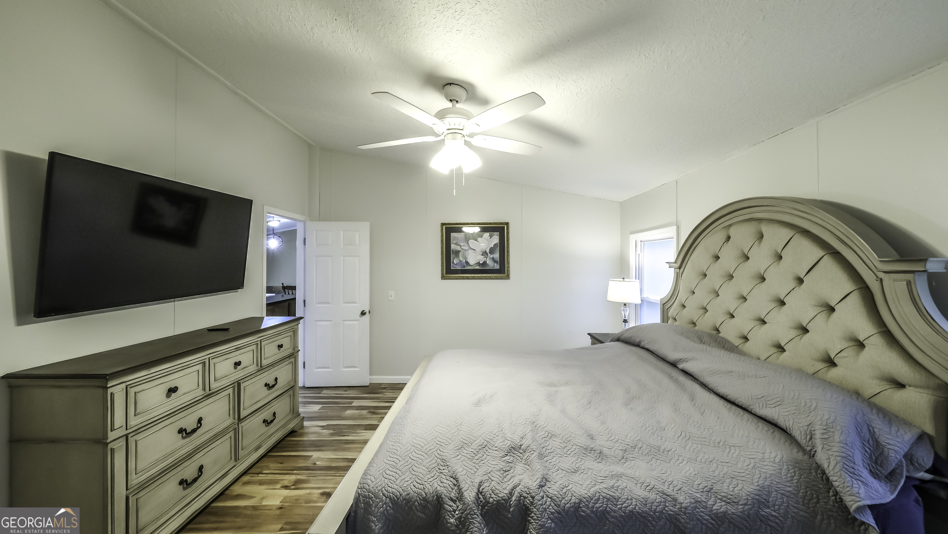 91 Holder Road Temple, GA 30179 - Photo 21 of 40 a bedroom with a bed and a flat screen tv
