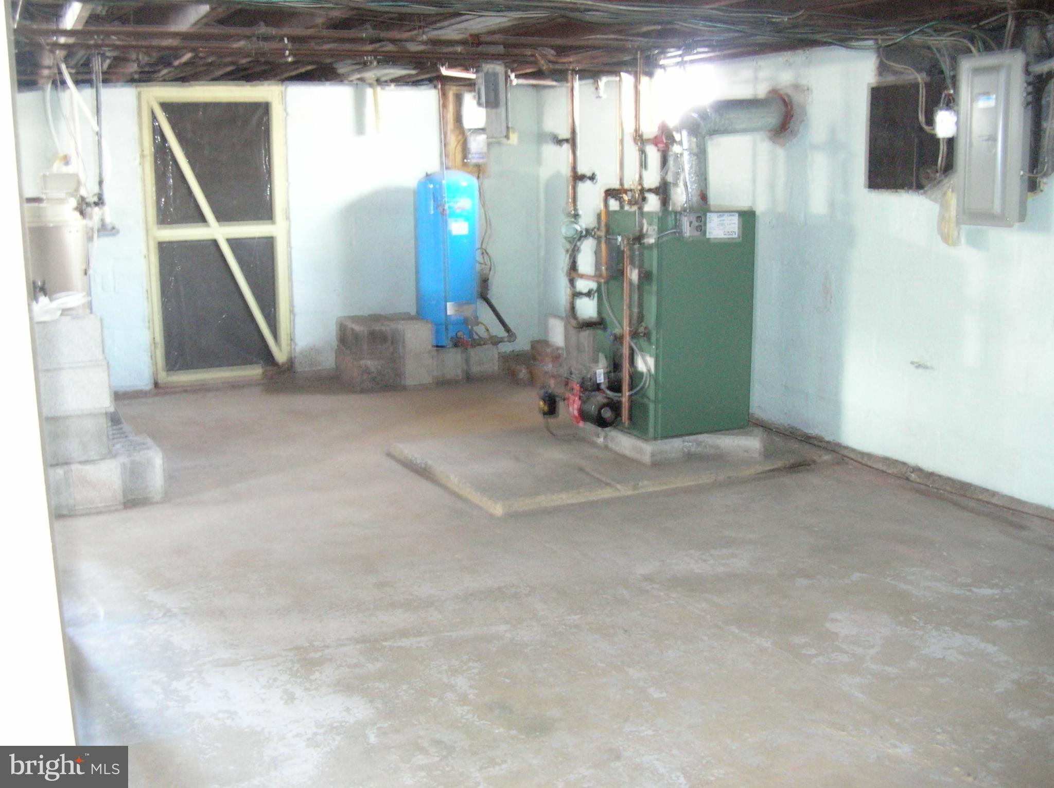 1642 Clearview Road Lansdale, PA 19446 - Photo 22 of 32 Basement w/heater, hot water and exit