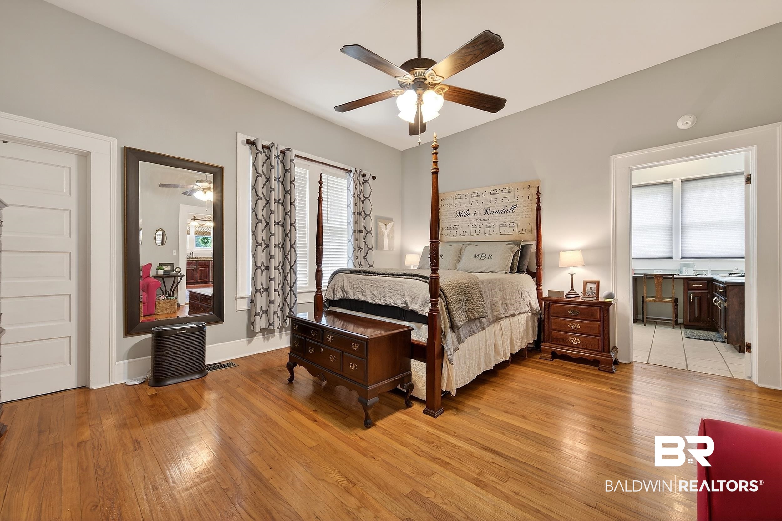 79 Mims Street Monroeville, AL 36460 - Photo 23 of 27 Bedroom with ensuite bath, hardwood / wood-style floors, and ceiling fan
