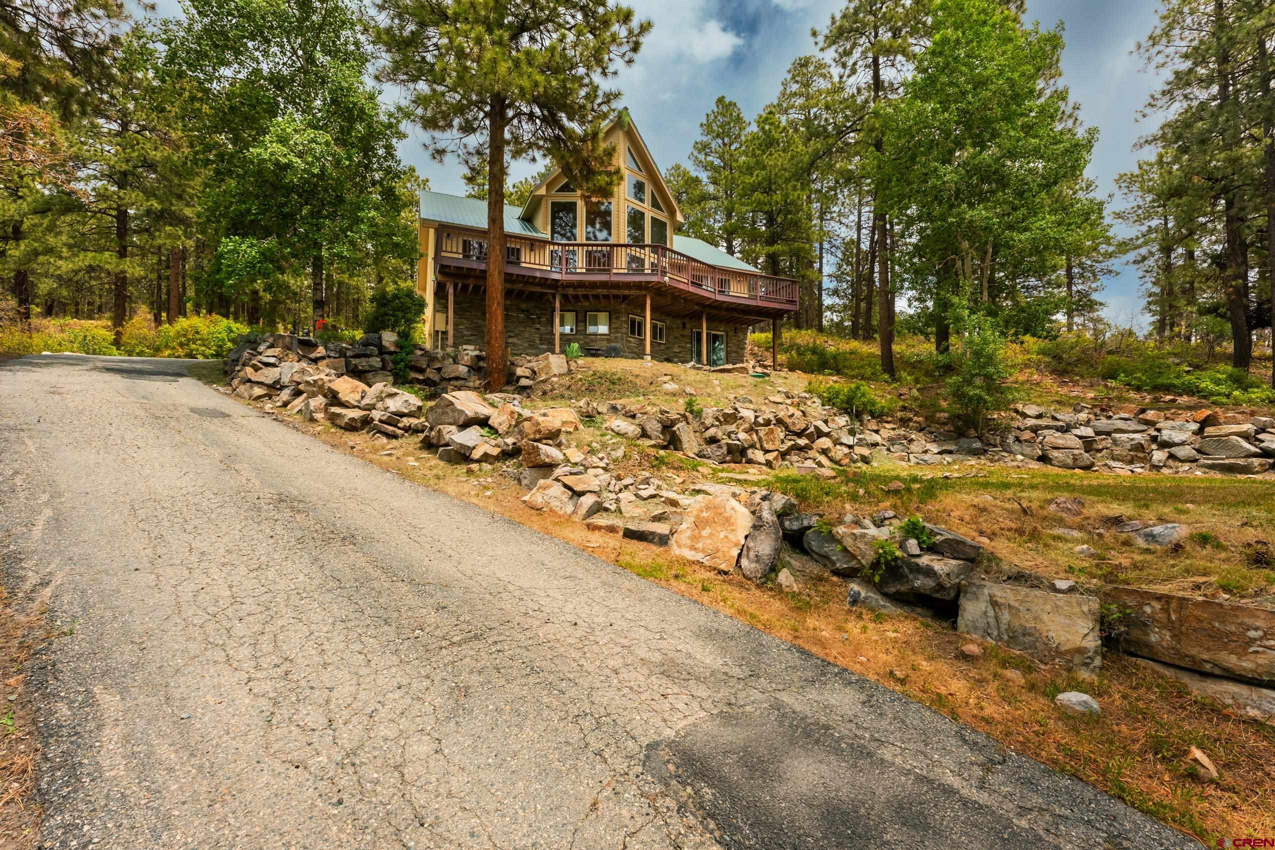 197 Buckhorn Road Bayfield, CO 81122 - Photo 33 of 34 a front view of a house with a yard