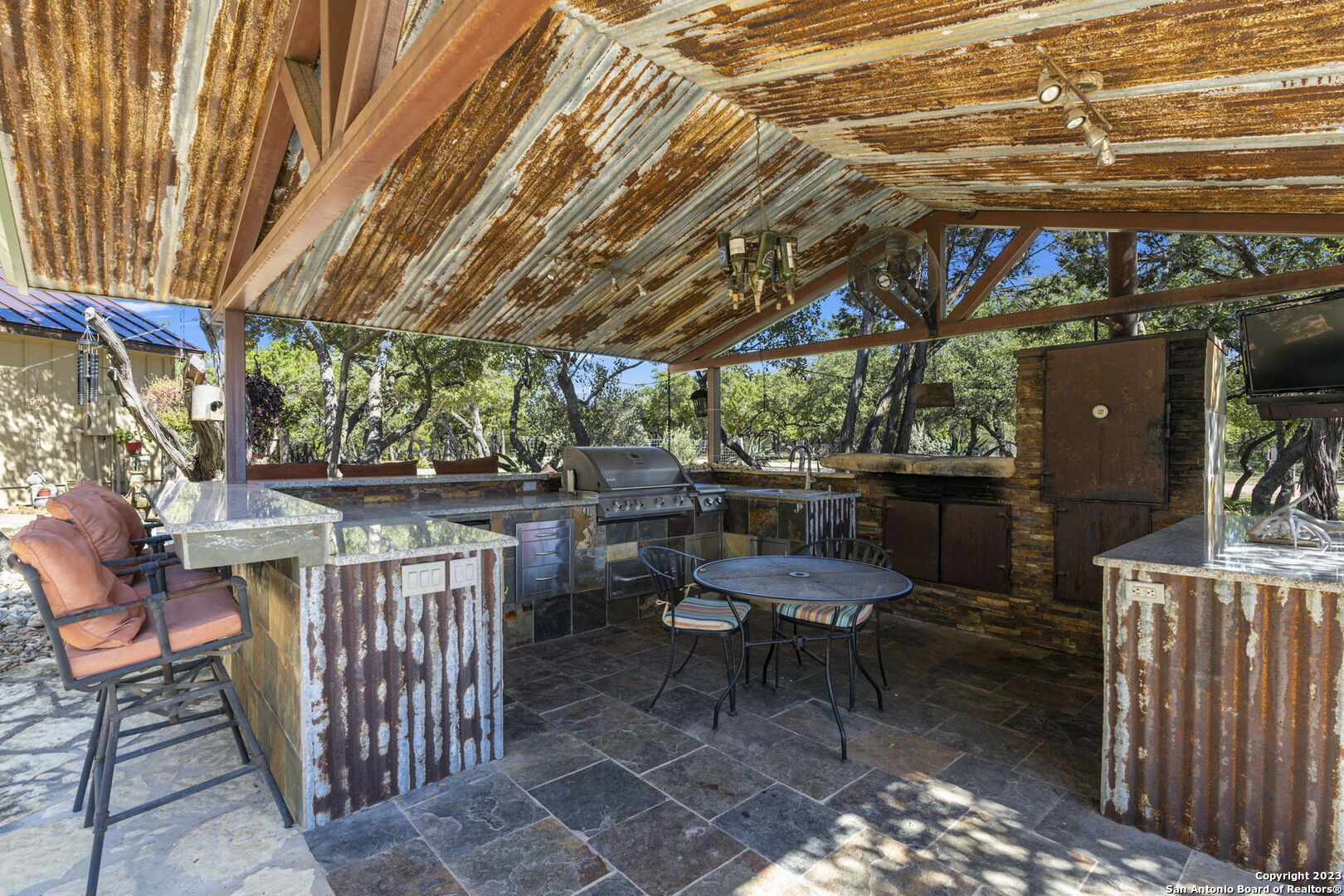 849 Madrona Ridge Drive Bandera, TX 78003 - Photo 11 of 44 a patio with a table and chairs