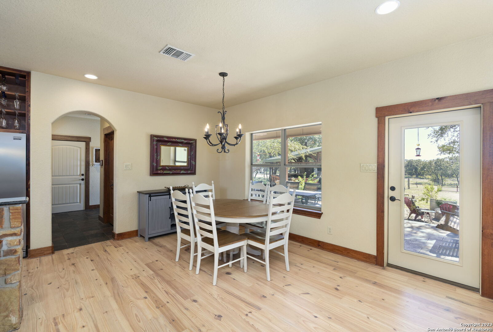 849 Madrona Ridge Drive Bandera, TX 78003 - Photo 14 of 44 a view of a dining room with furniture window and wooden floor