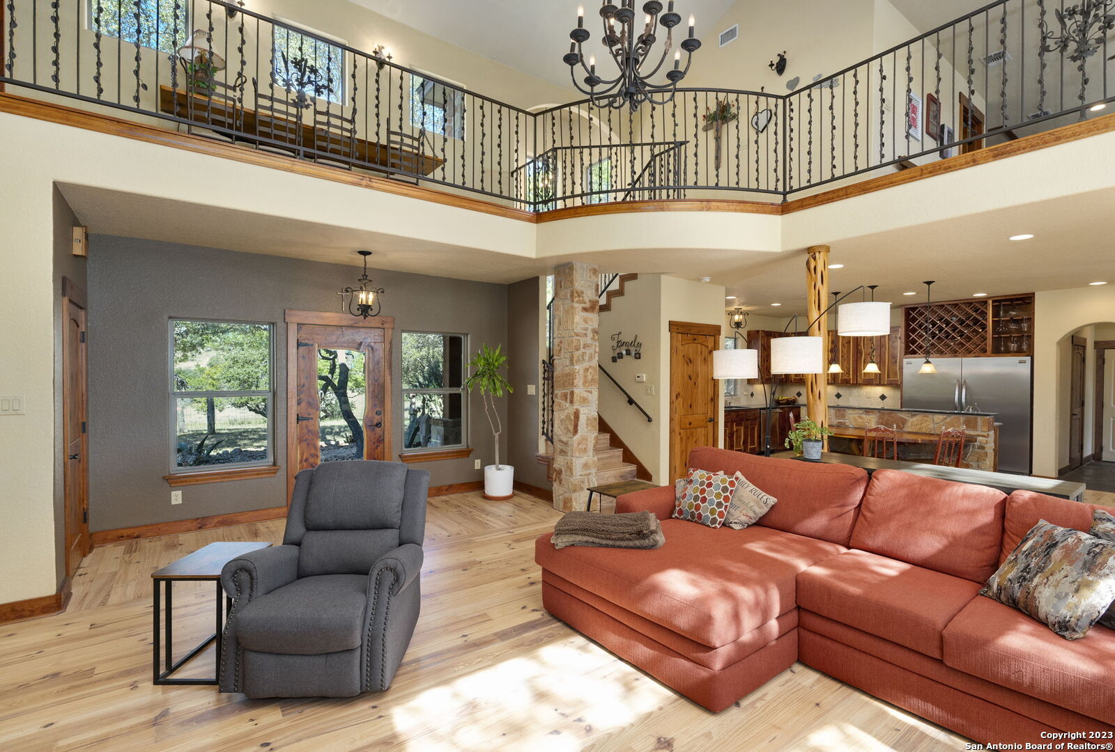 849 Madrona Ridge Drive Bandera, TX 78003 - Photo 16 of 44 a living room with furniture a ceiling fan a rug and a window